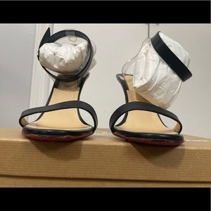 Christian Louboutin
Jonatina PVC & Leather Sandals 41